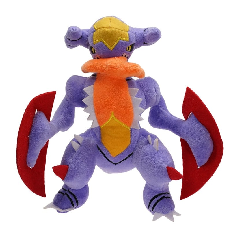 Peluche Garchomp tendre violet devant un arrière-plan blanc.