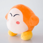 Peluche kirby étoile mignon orange devant un arrière plan blanc.