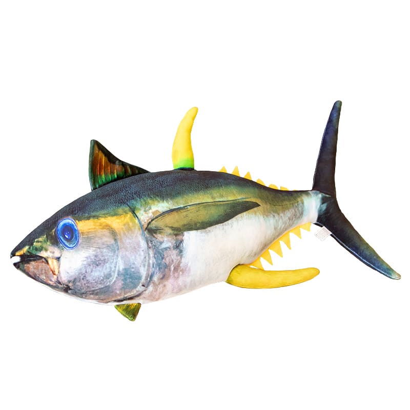 Peluche Poisson géante réaliste devant un arrière plan blanc.